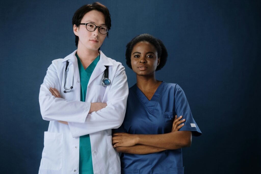 pexels-photo-5722156-5722156 A confident doctor and nurse posing in a studio setting.